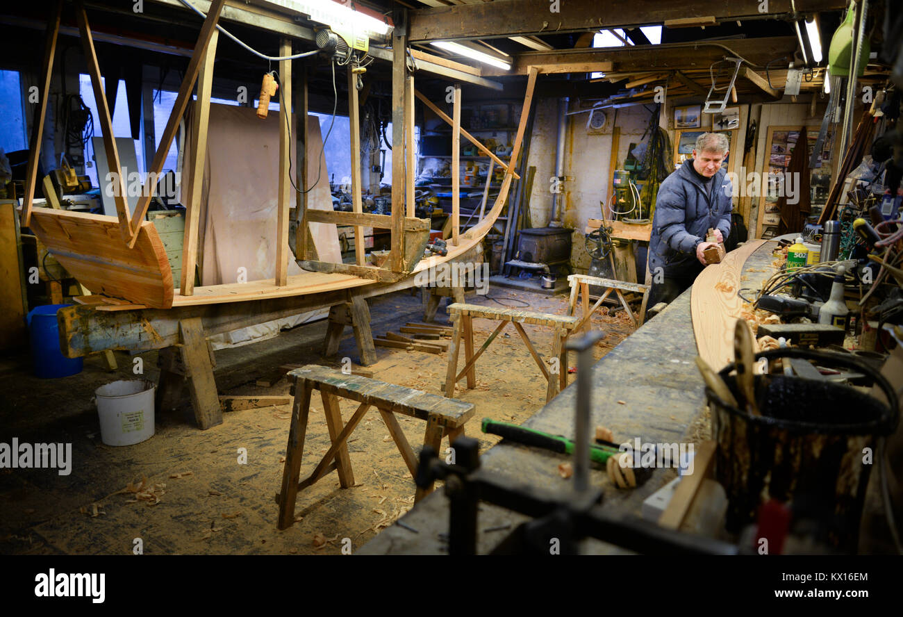 Ian Simpson the last builder of traditional Tweed boats at work on a boat Stock Photo