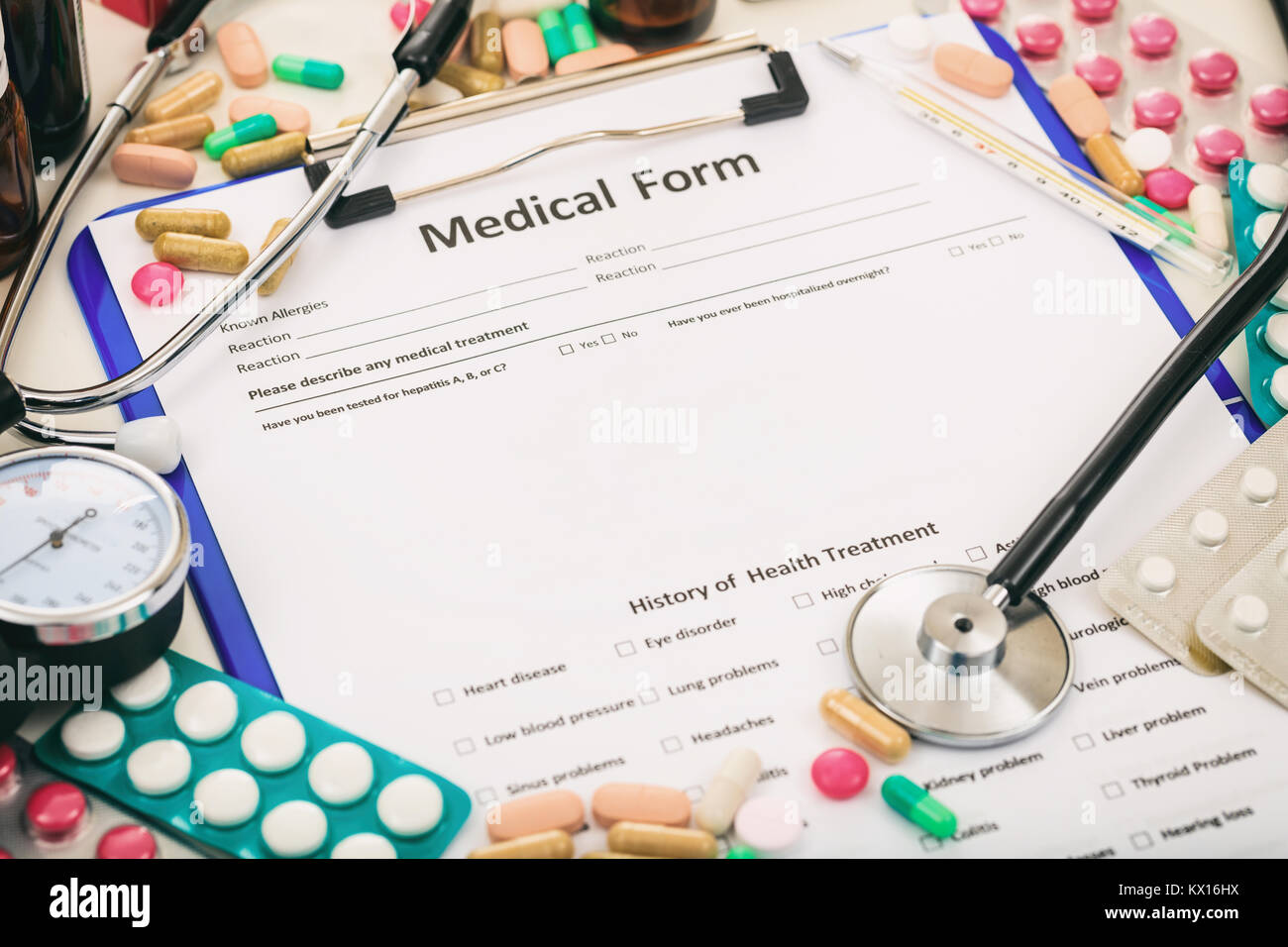 Medical form and stethoscope on a table Stock Photo - Alamy