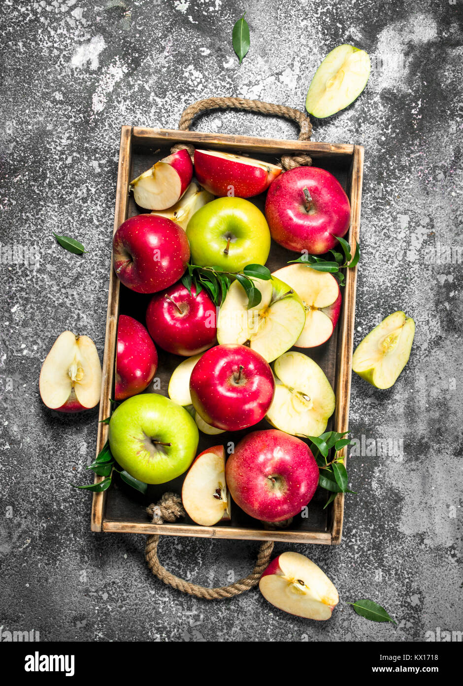 Red and green apples in a wooden tray. On a rustic background Stock ...