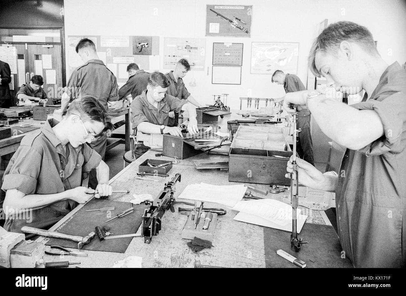British army squaddies undergoing basic training in a workshop armoury for weapons maintainance training, England, 15th June 1993 Stock Photo