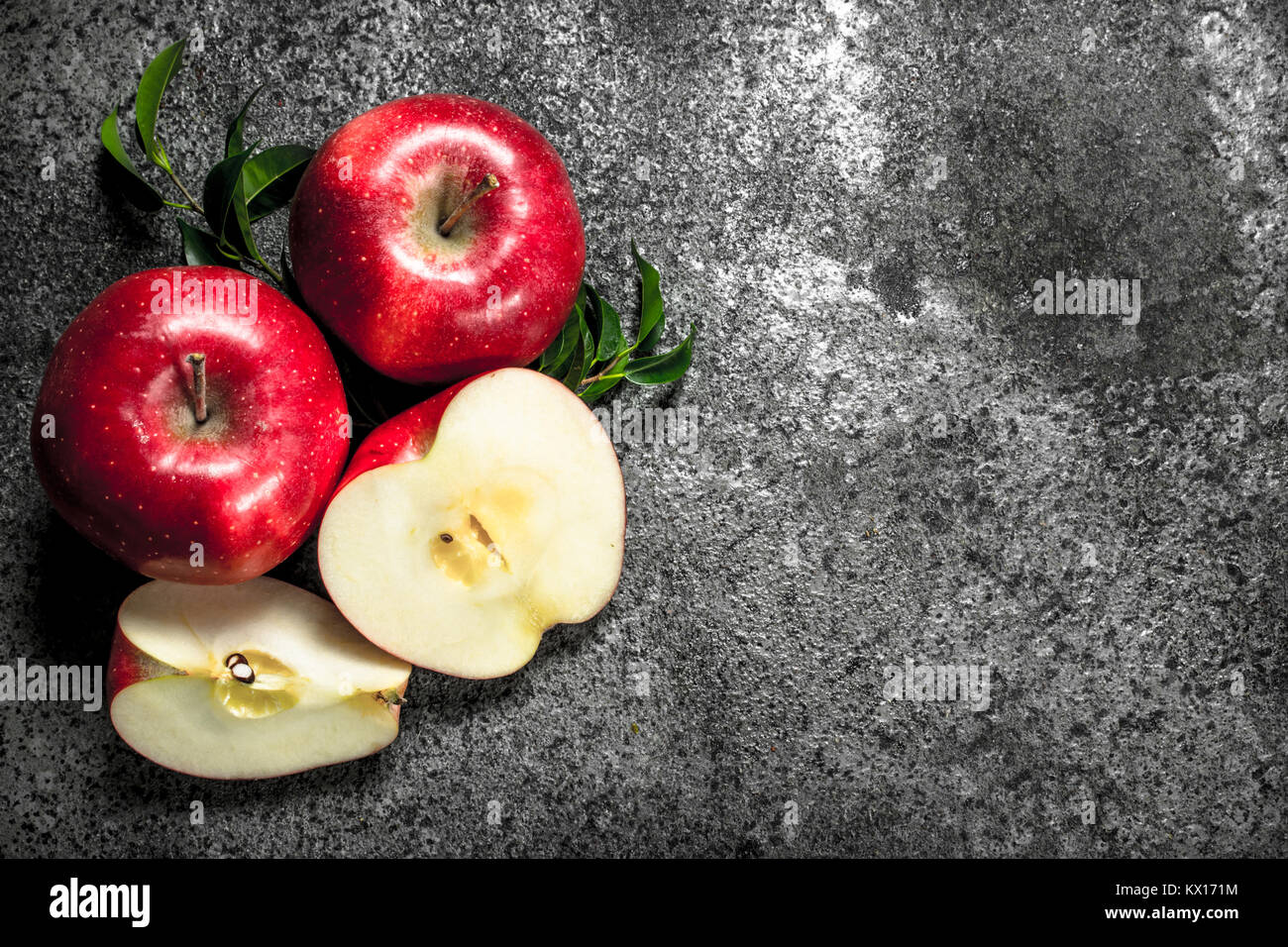Fresh red apples. On a rustic background Stock Photo - Alamy