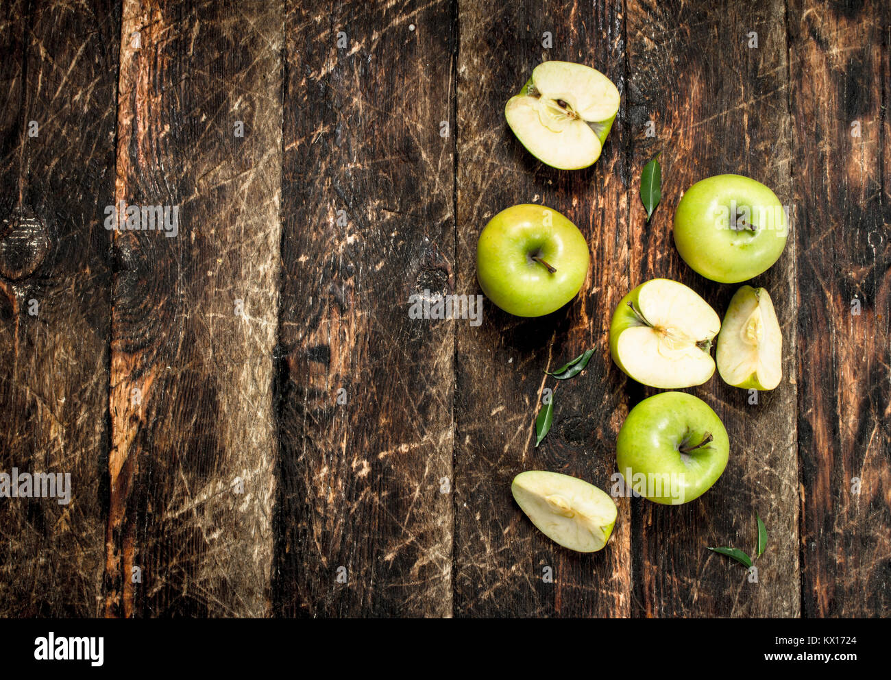 Green fresh apples. On a wooden background Stock Photo - Alamy