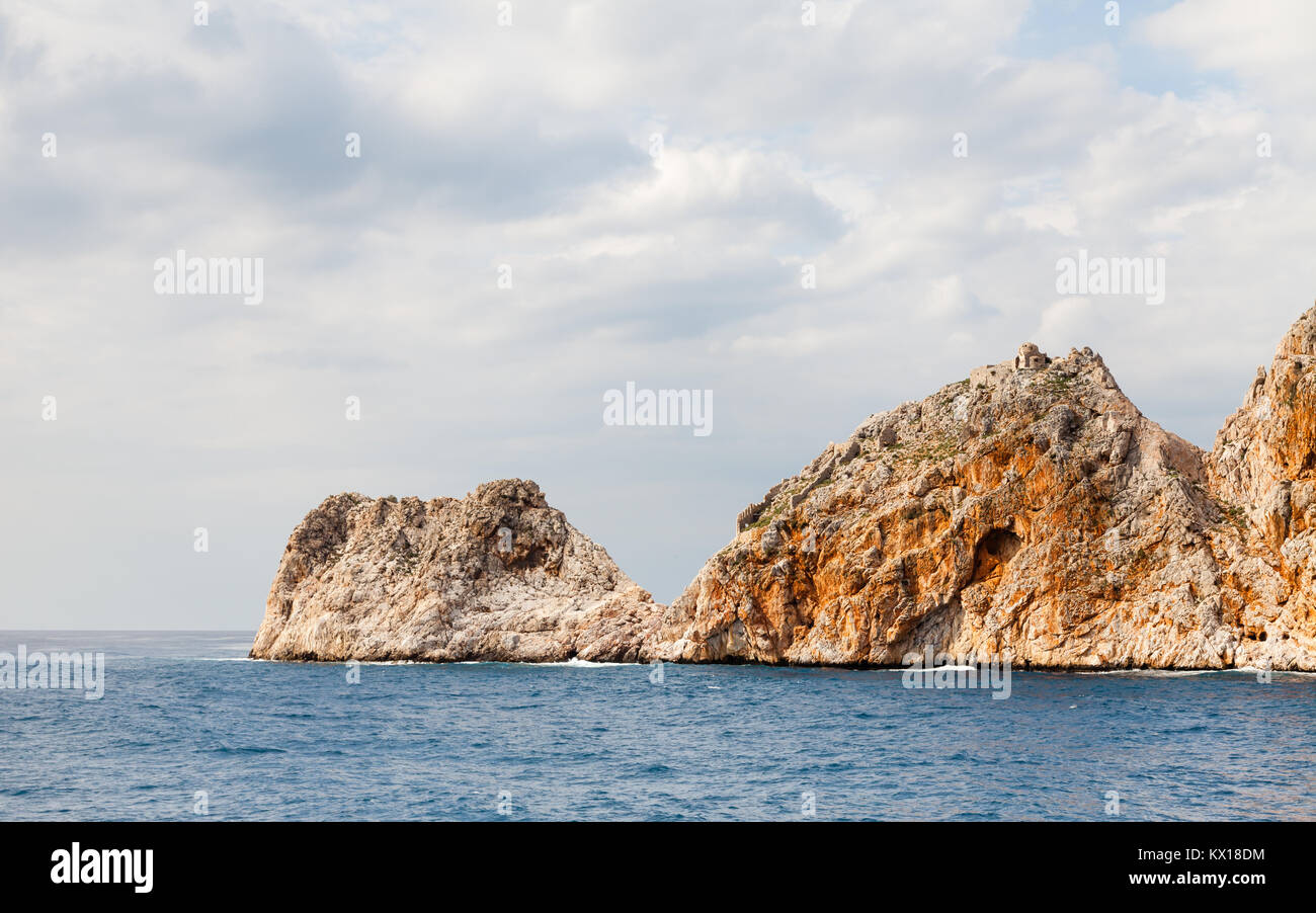 Alanya Coastline.  The rocky peninsula of Alanya as viewed from the Mediterranean Sea.  Alanya is a resort in southern Turkey. Stock Photo
