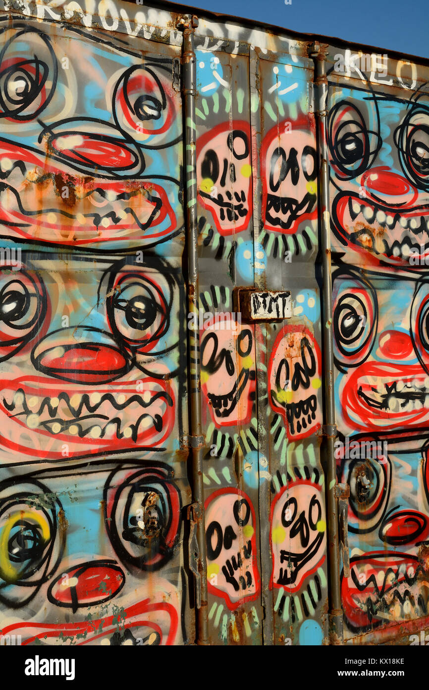 An old shipping container decorated with graffiti Stock Photo Alamy