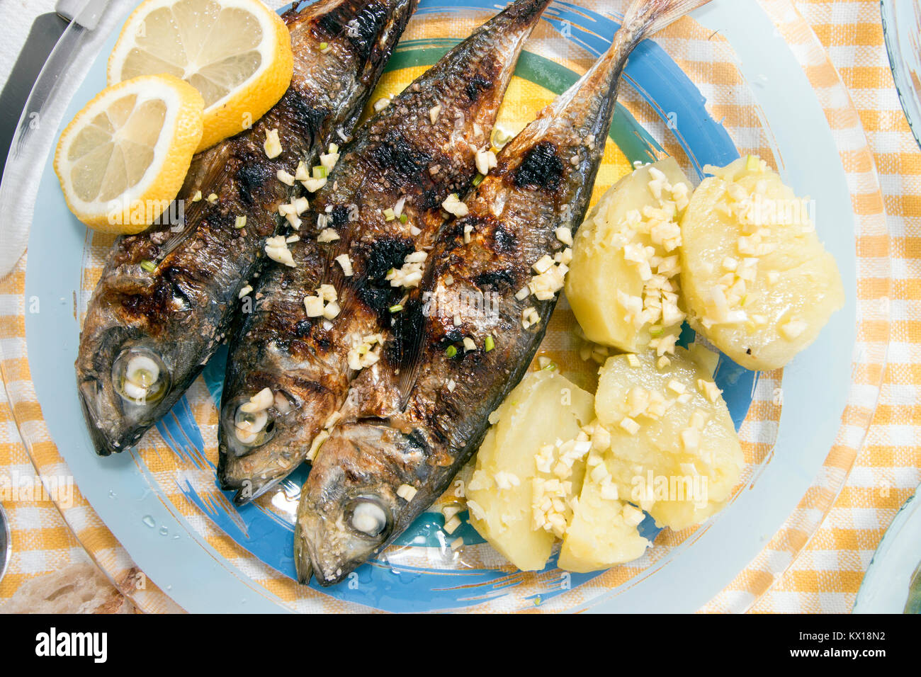Grilled atlantic horse mackerel meal with potatoes Stock Photo Alamy