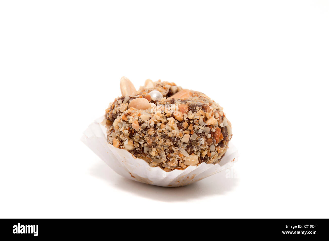 Traditional portuguese sweet of fig, carob and almond ball isolated on