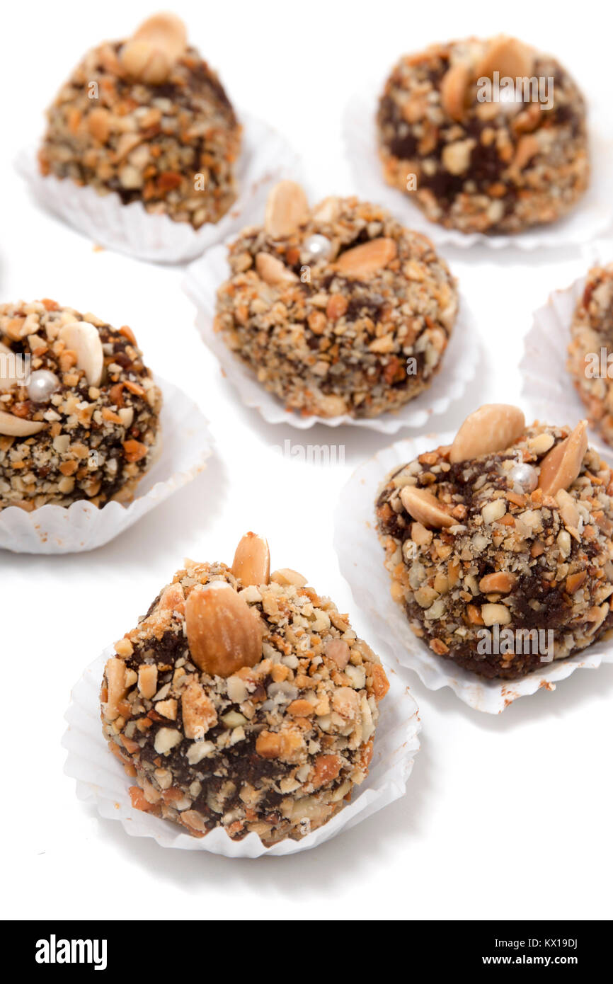 Traditional portuguese sweet of fig, carob and almond balls isolated on
