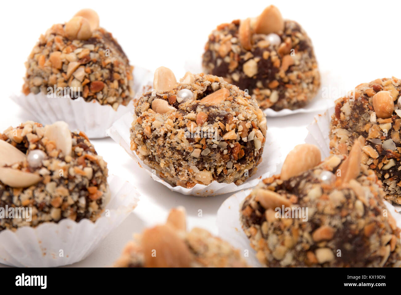 Traditional portuguese sweet of fig, carob and almond balls isolated on