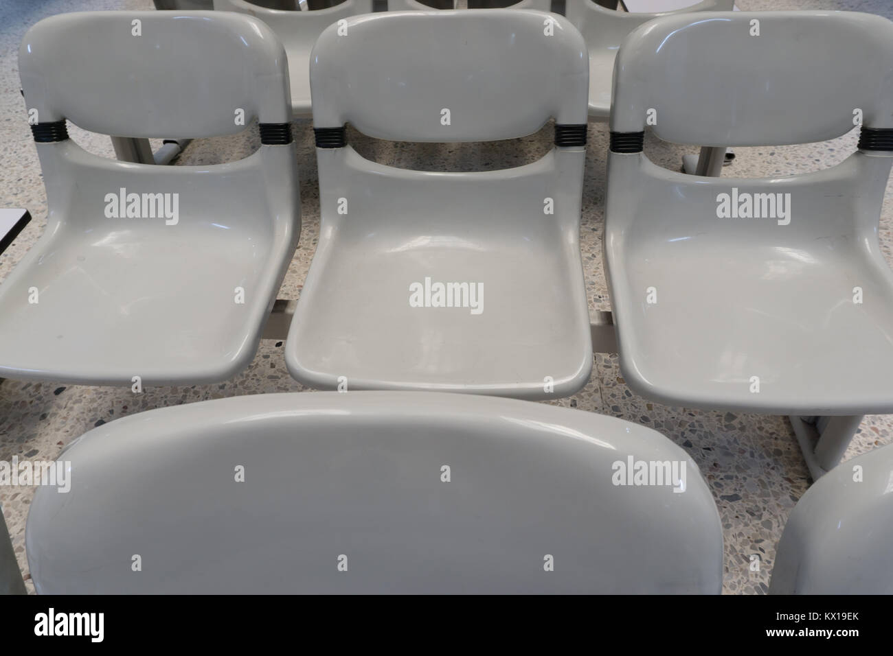 A group of empty chair inside a building Stock Photo