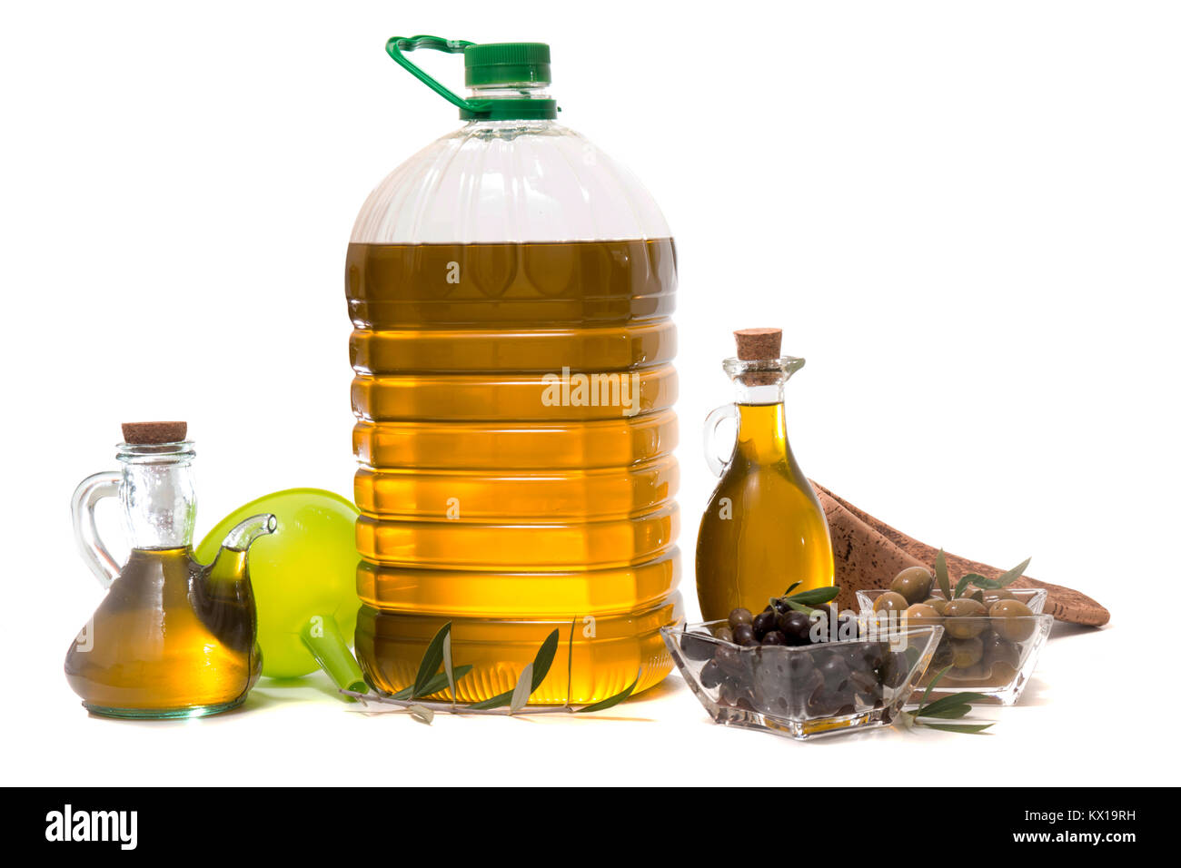 Green and black olives with olive oil bottle isolated on a white ...