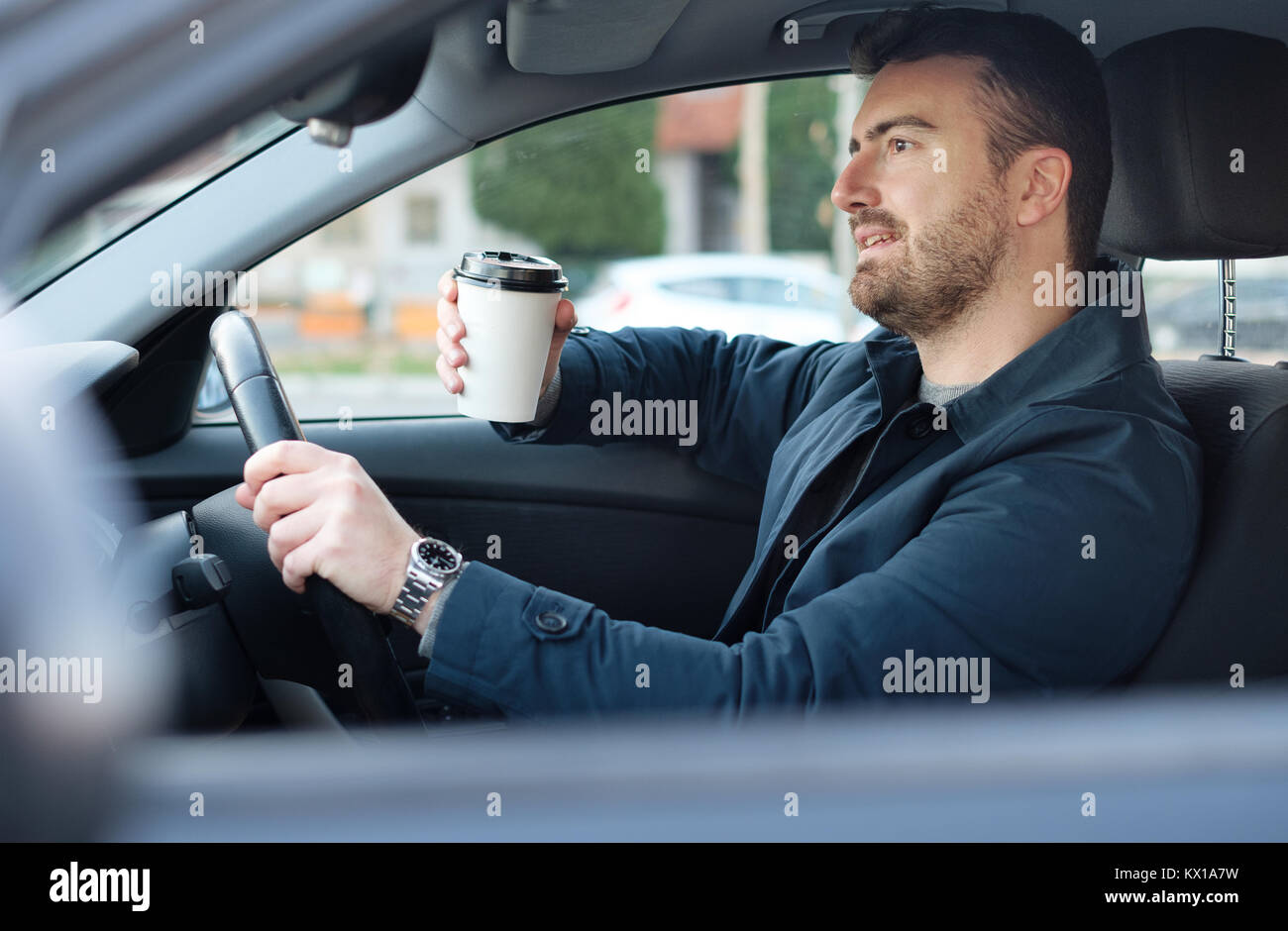 Man drinking coffee driving car hires stock photography and images Alamy