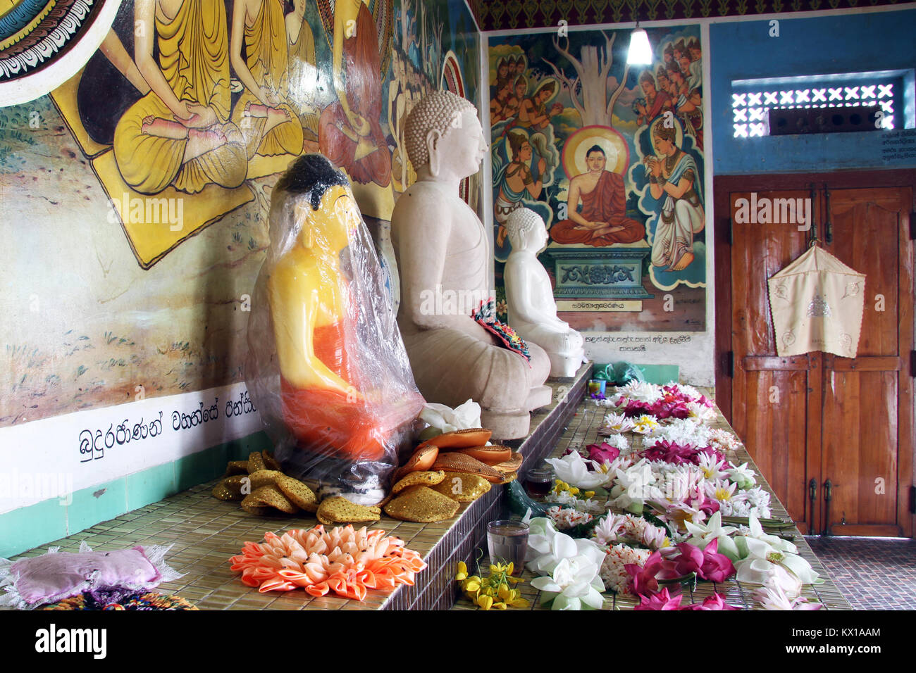 Buddhas on the shrine near stupa in Tisssamaharama, Sri Lanka Stock Photo -  Alamy