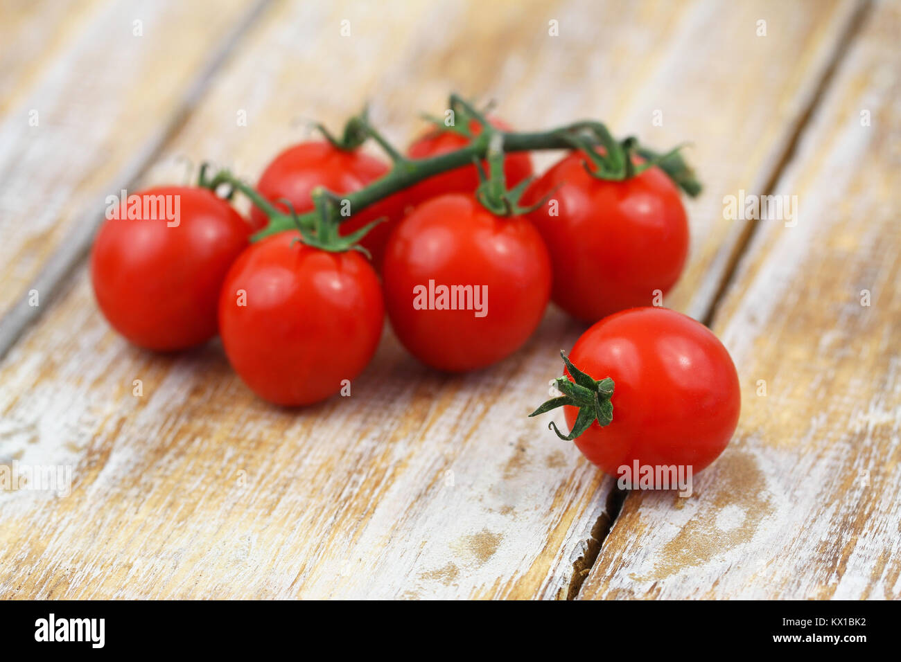 Ripe, juicy cherry tomatoes on rustic wood, closeup Stock Photo