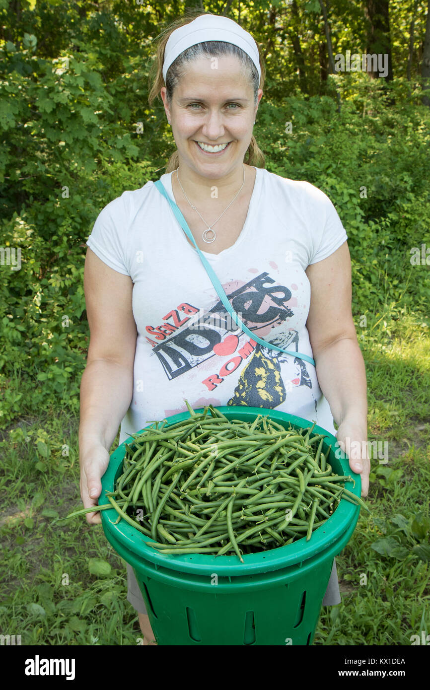 Farm volunteers with just picked vegetables for the Worcester, MA food