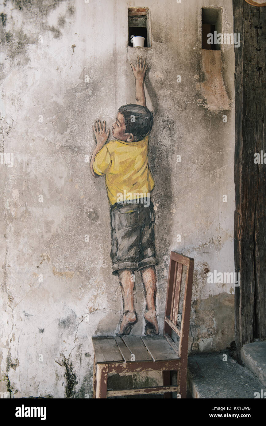 Street art by Ernest Zacharevic in Georgetown, Penang, Malaysia. Stock Photo