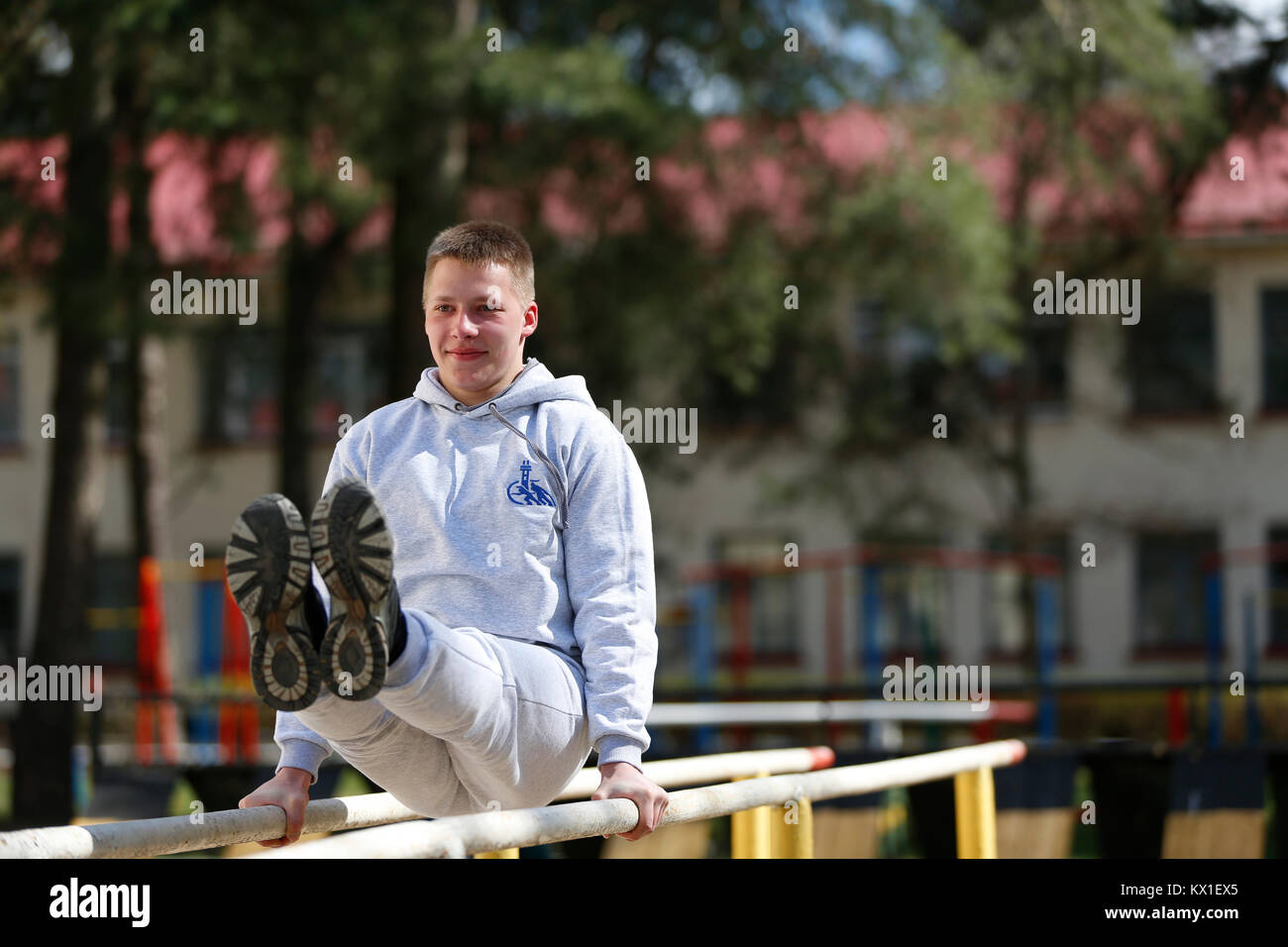 Belarus, Gomel, 21 April 2017. Open lesson on fire fighting. Exercises on the crossbar.Physical culture lesson. A young gymnast. Sports training of so Stock Photo