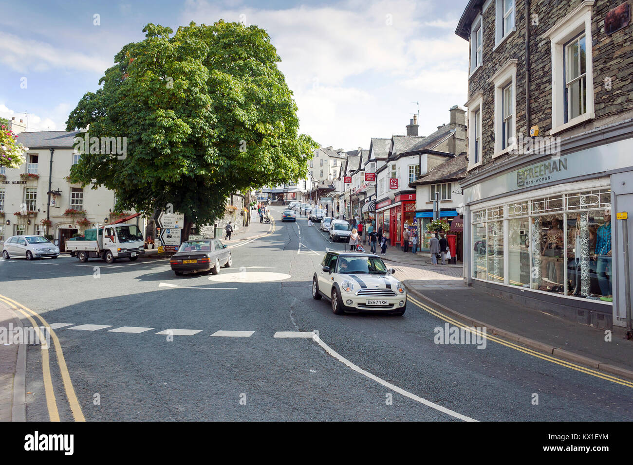 Bowness on Windermere, Cumbria, UK - August 27, 2010: People shopping on Crag Brow a busy street of shops in the tourist town Bowness on Windermere Stock Photo