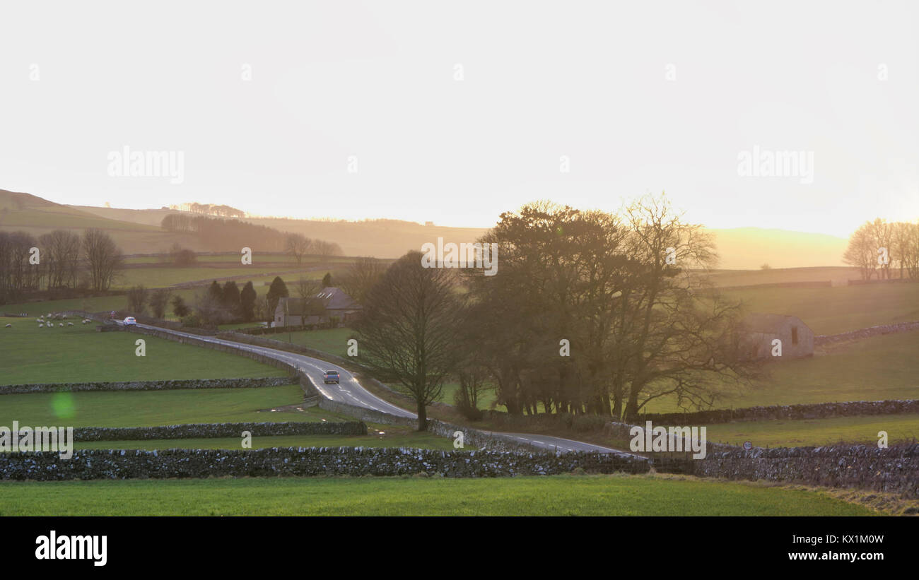 UK Weather: spectacular sunset along the A515 road between Buxton & Ashbourne in the Peak District National Park, Derbyshire Stock Photo