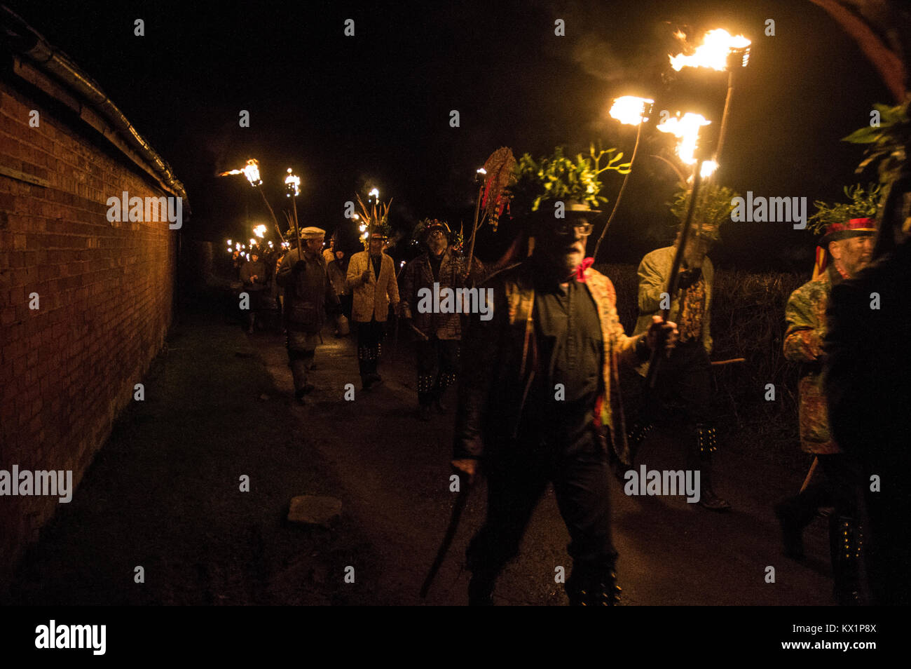 LEOMINSTER - JANUARY 06: Members of the Leominster Morris lead crowds from the Crown Inn  to the nearby apple orchard of Mr Richard Wellings to take part in a torchlit  Cider wassailing ceremony ahead of Twelfth Night in Dilwyn, Herefordshire, England, on January 6th 2018. Credit: Jim Wood/Alamy Live News Stock Photo