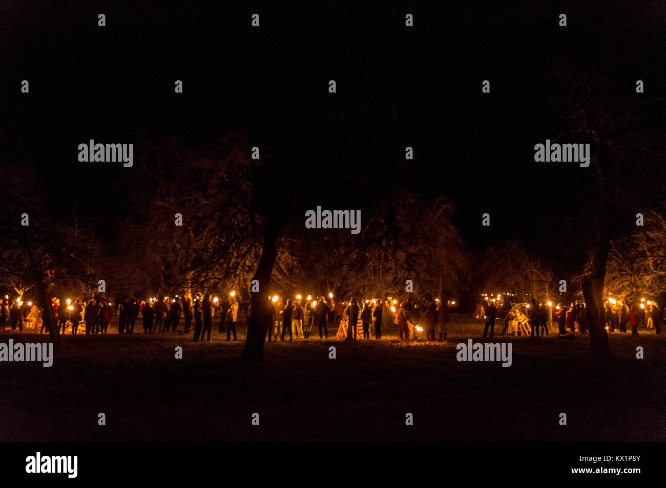 LEOMINSTER - JANUARY 06: Members of the Leominster Morris gather with crowds at the apple orchard of Mr Richard Wellings to take part in a torchlit  Cider wassailing ceremony ahead of Twelfth Night in Dilwyn, Herefordshire, England, on January 6th 2018. Credit: Jim Wood/Alamy Live News Stock Photo