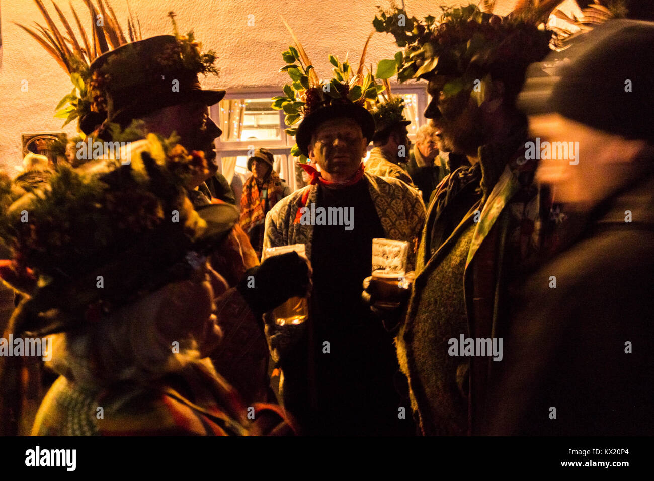 Dilwyn, Herefordshire, UK. 6th Jan, 2018. Members of the Leominster Morris seen gathering with crowds while exchanging a chat at the Crown Inn before heading to the apple orchard of Mr Richard Wellings to take part in a torchlit Cider wassailing ceremony ahead of Twelfth Night. Credit: ZUMA Press, Inc./Alamy Live News Stock Photo