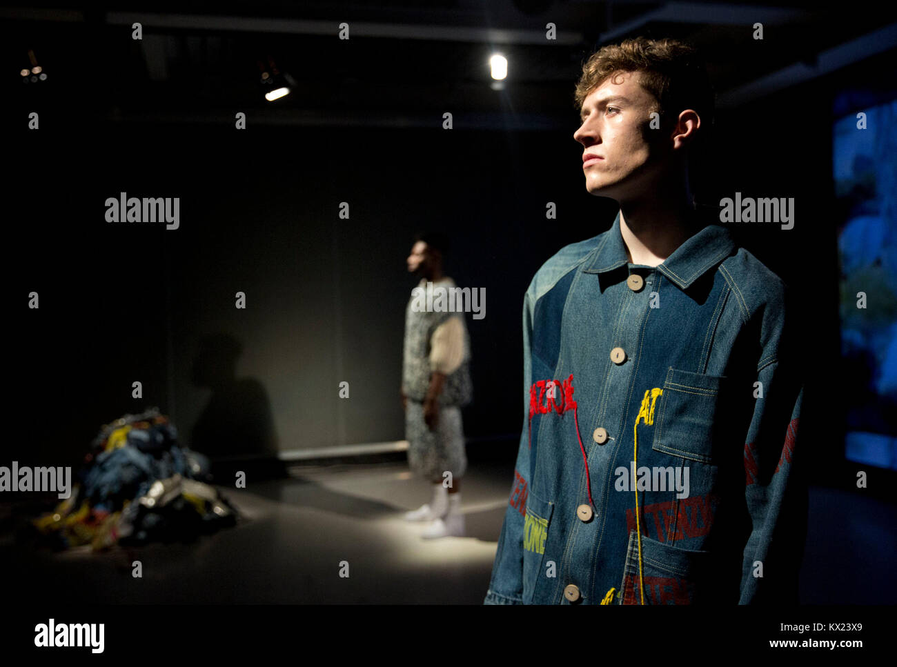 Models are presented during the Bethany Williams London Fashion Week Men's AW18 show, held at BFC Show Space, London. Stock Photo