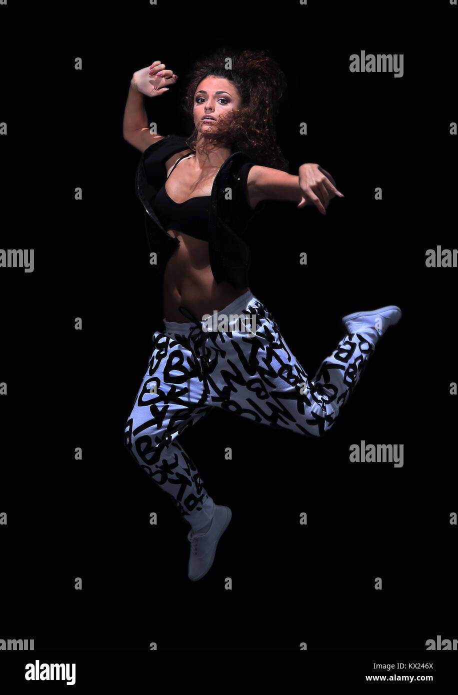 Beautiful woman dancer in hip hop attire striking a pose isolated on white  background Stock Photo - Alamy