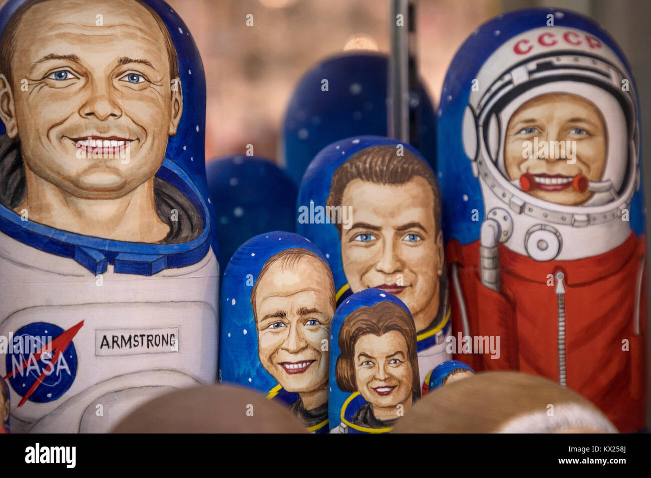 Portraits of famous cosmonauts made in the form of Russian matryoshka lie on the counter of a souvenir shop in the center of Moscow, Russia Stock Photo