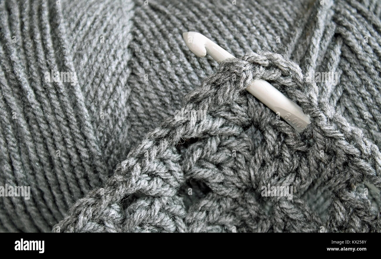 Skein of Gray wool with Crochet hook Stock Photo