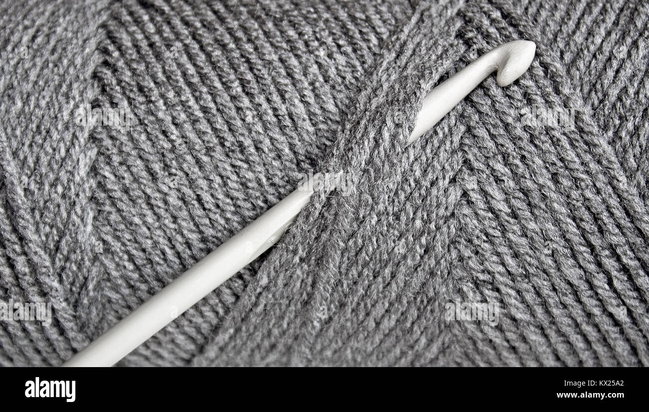 Skein of Gray wool with Crochet hook Stock Photo