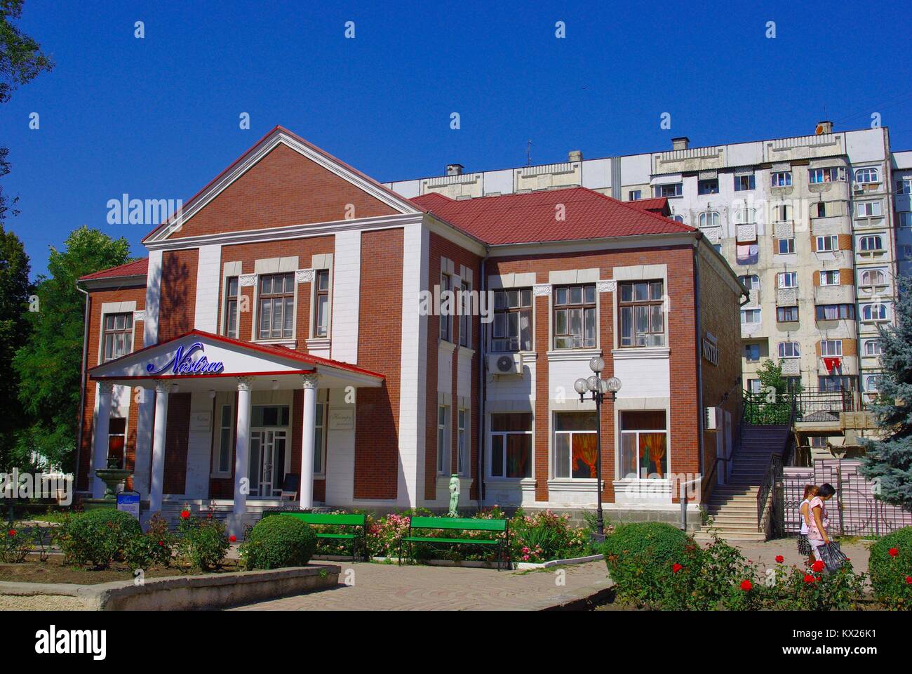 The City of Bălți (Belcy) in the Republic of Moldova: The Restaurant Nistru and a Sovjet style block Stock Photo