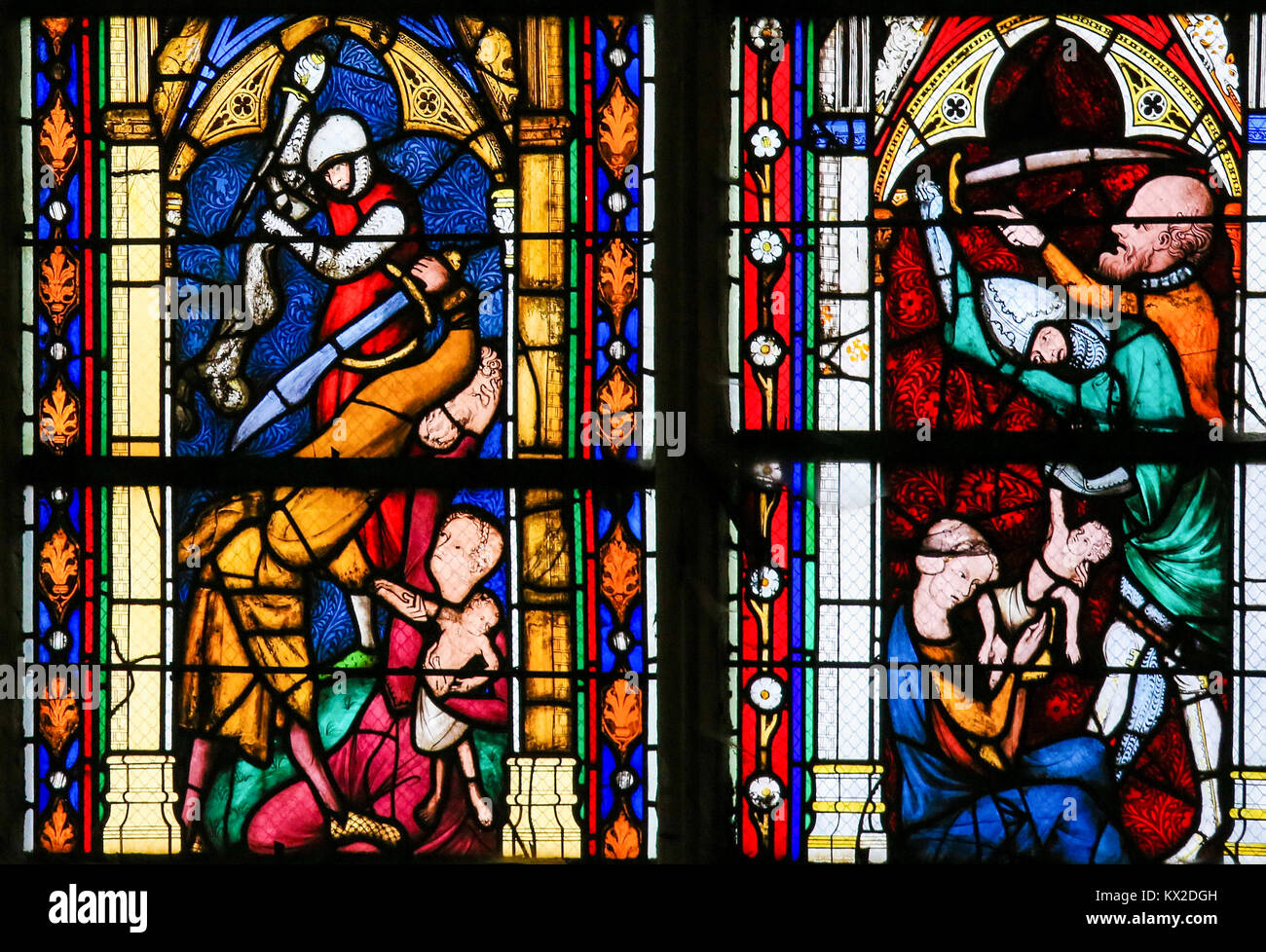 The Massacre of the Innocents, the biblical recount of infanticide by Herod the Great, on a stained glass in the cathedral of Rouen. Stock Photo