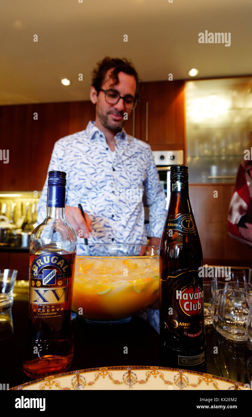 An adult man mixing punch Stock Photo