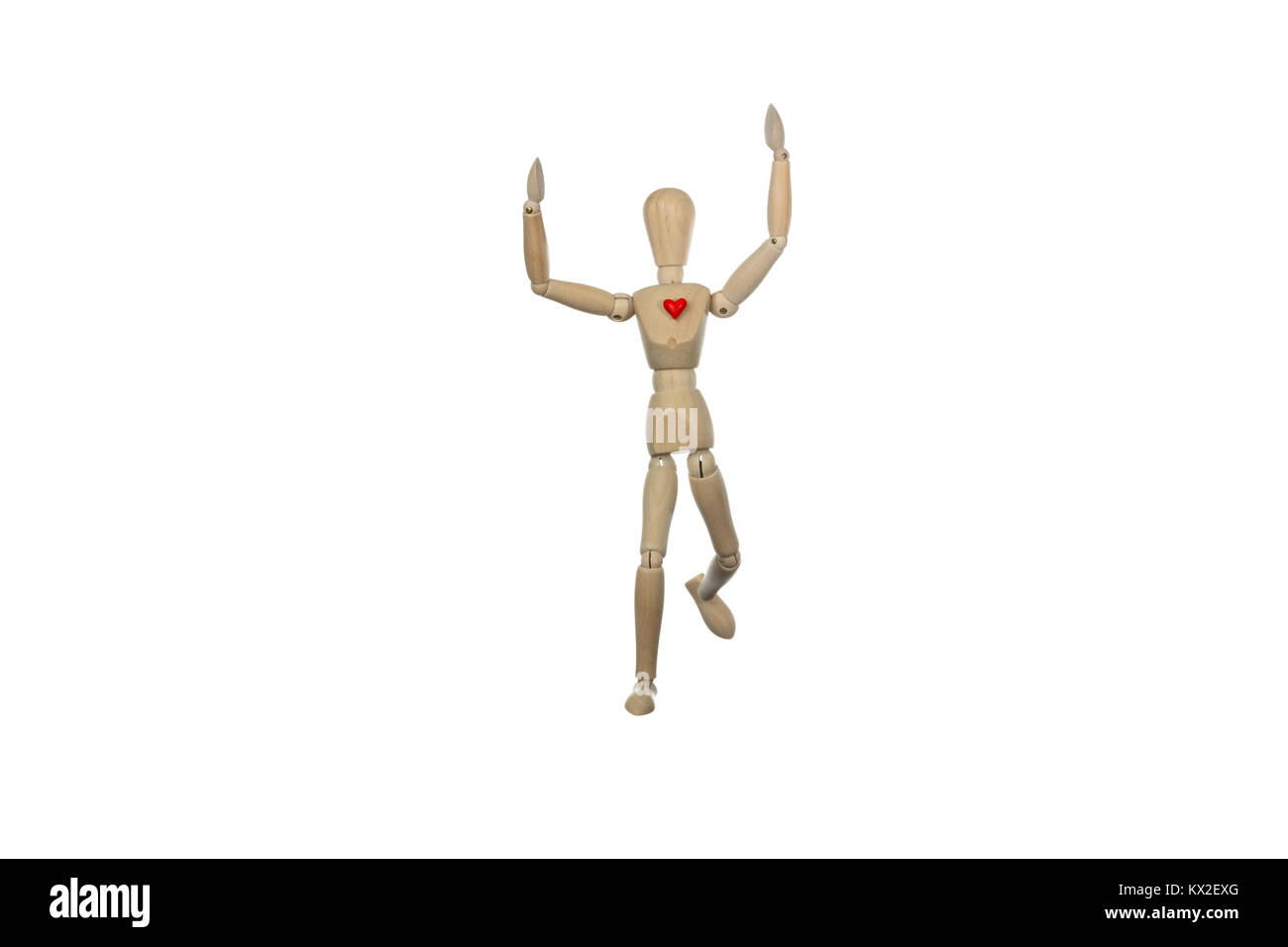 wooden mannequin winning a race with a red heart, conceptual photo about  healthy lifestyle practicing a sport Stock Photo