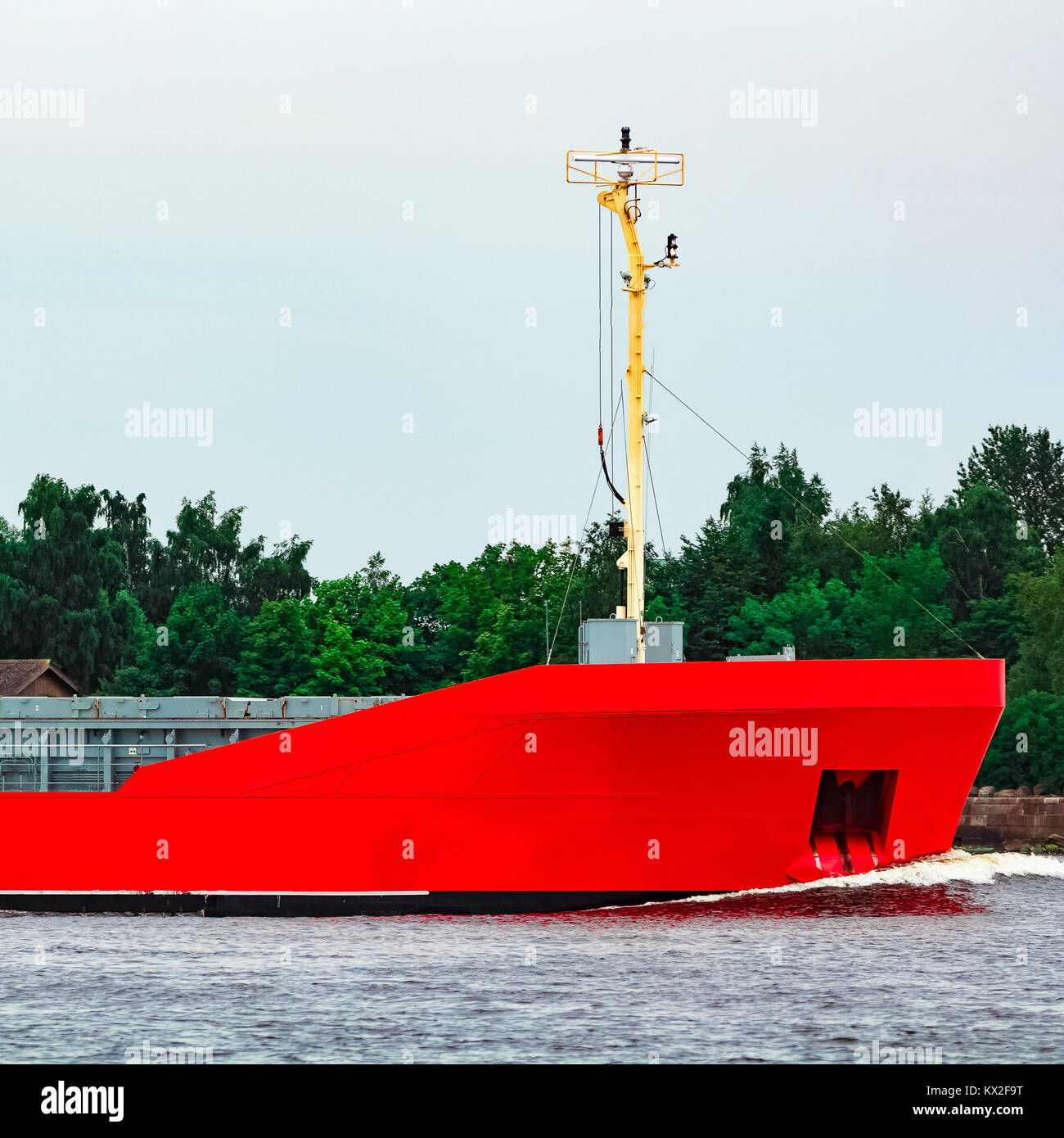 Orange cargo ship. Logistics and merchandise transportations Stock