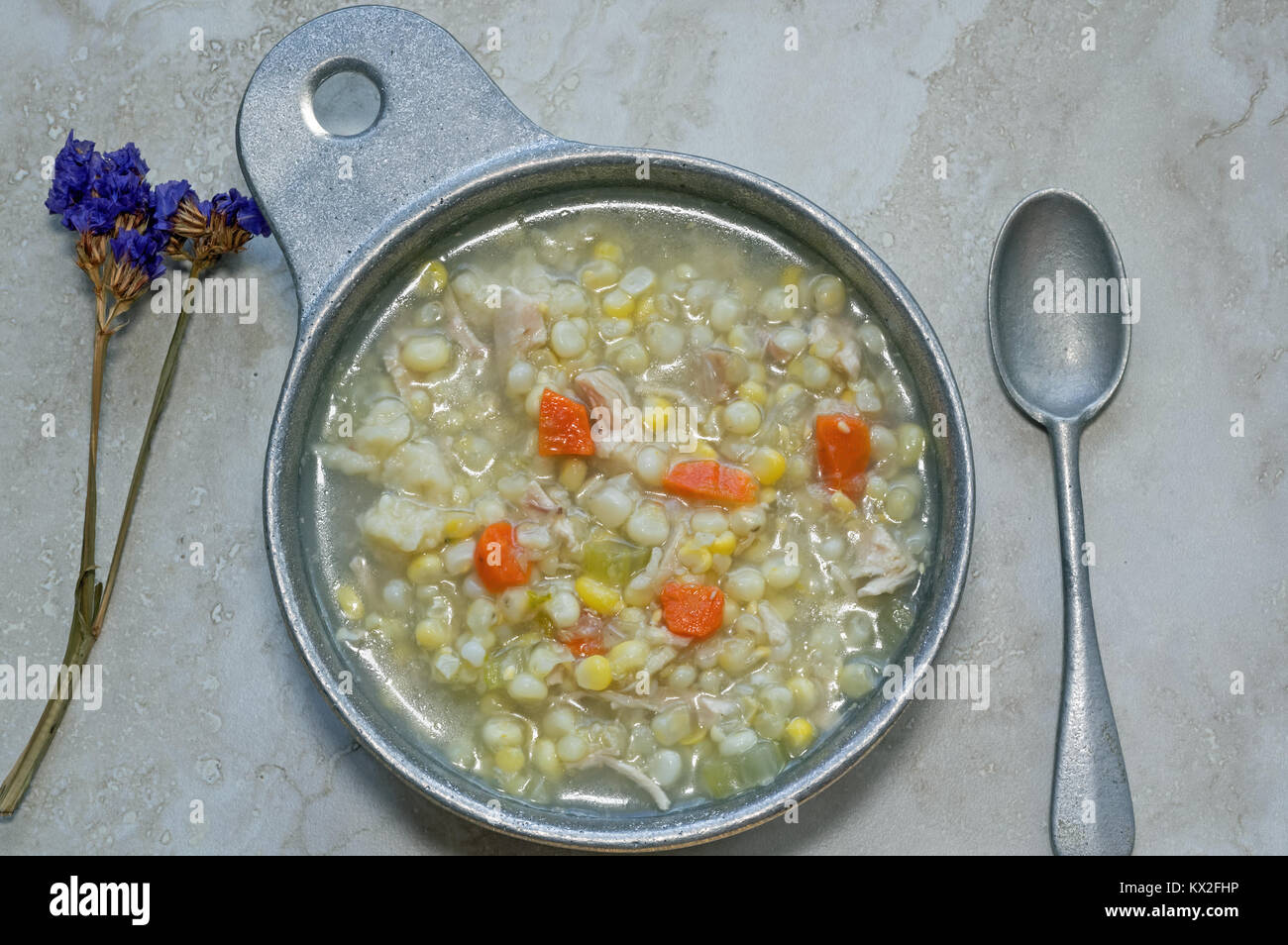 Chicken Corn soup with rivels in metal soup bowl. It is an Amish