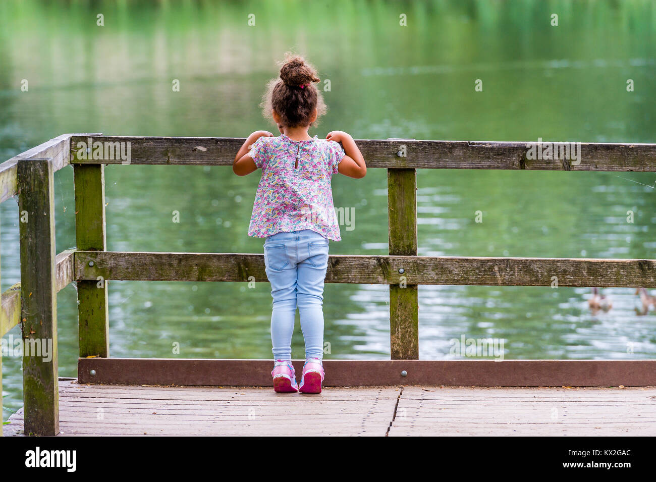 baby stands on tiptoes