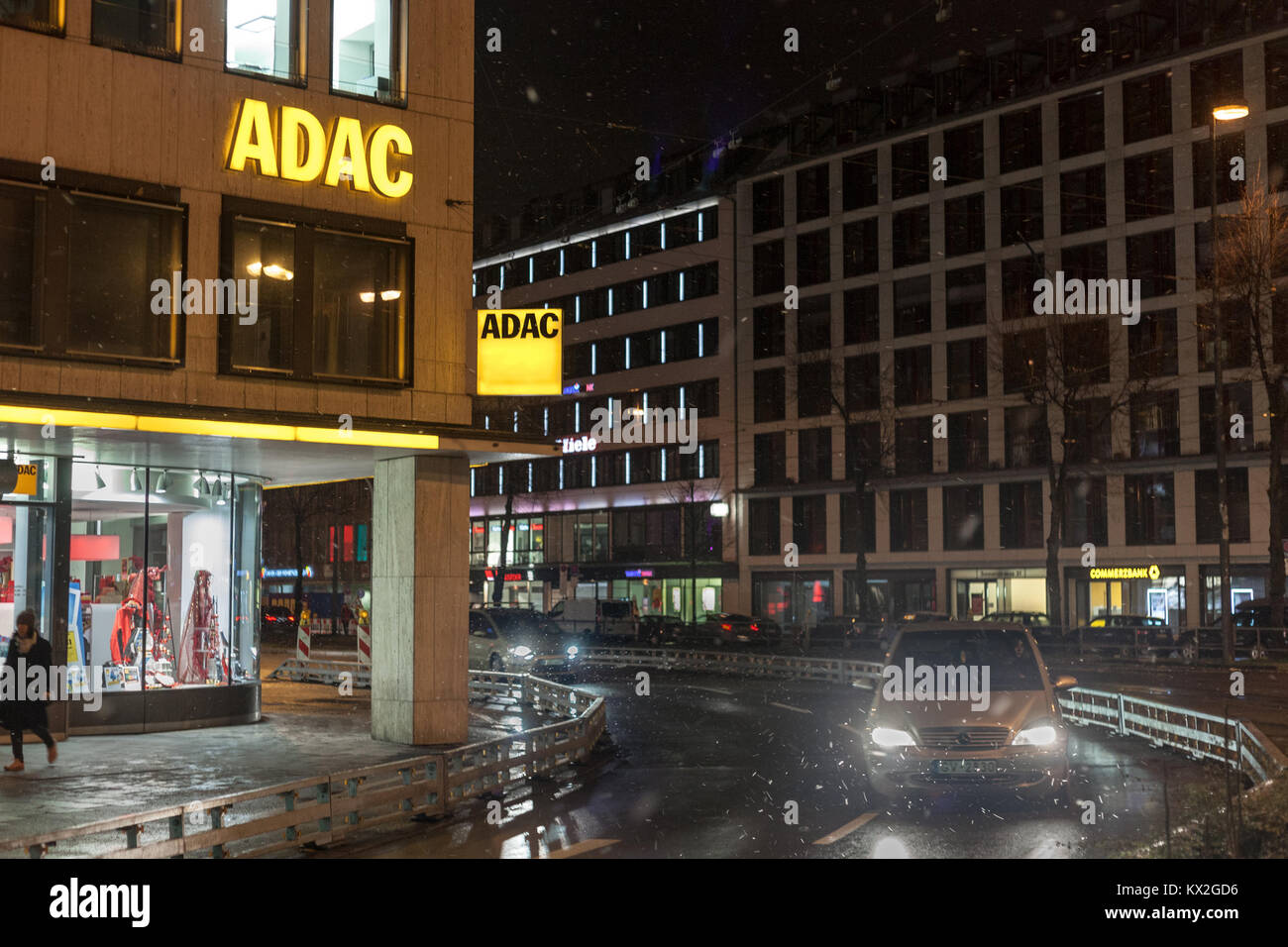 MUNICH, GERMANY - DECEMBER 17, 2017: ADAC logo on their downtown Munich main office taken during a snowy night. The ADAC is the main Automobile club i Stock Photo