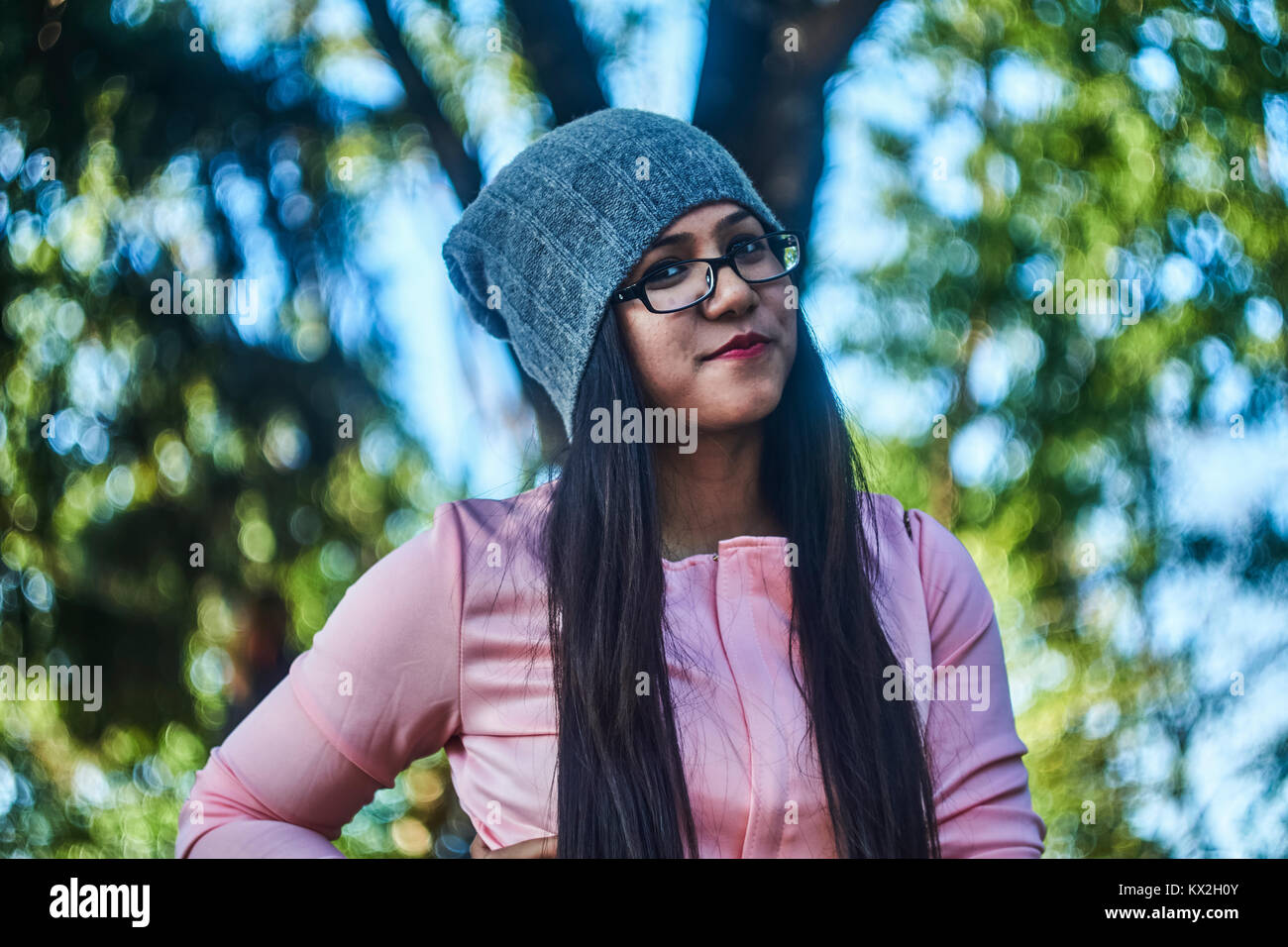 Girl wearing eye glasses looking at the camera. Stock Photo