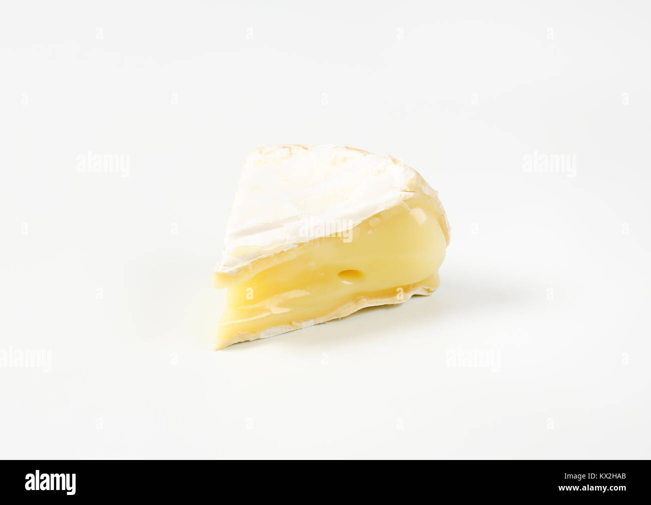 piece of soft-ripened cheese with white rind Stock Photo