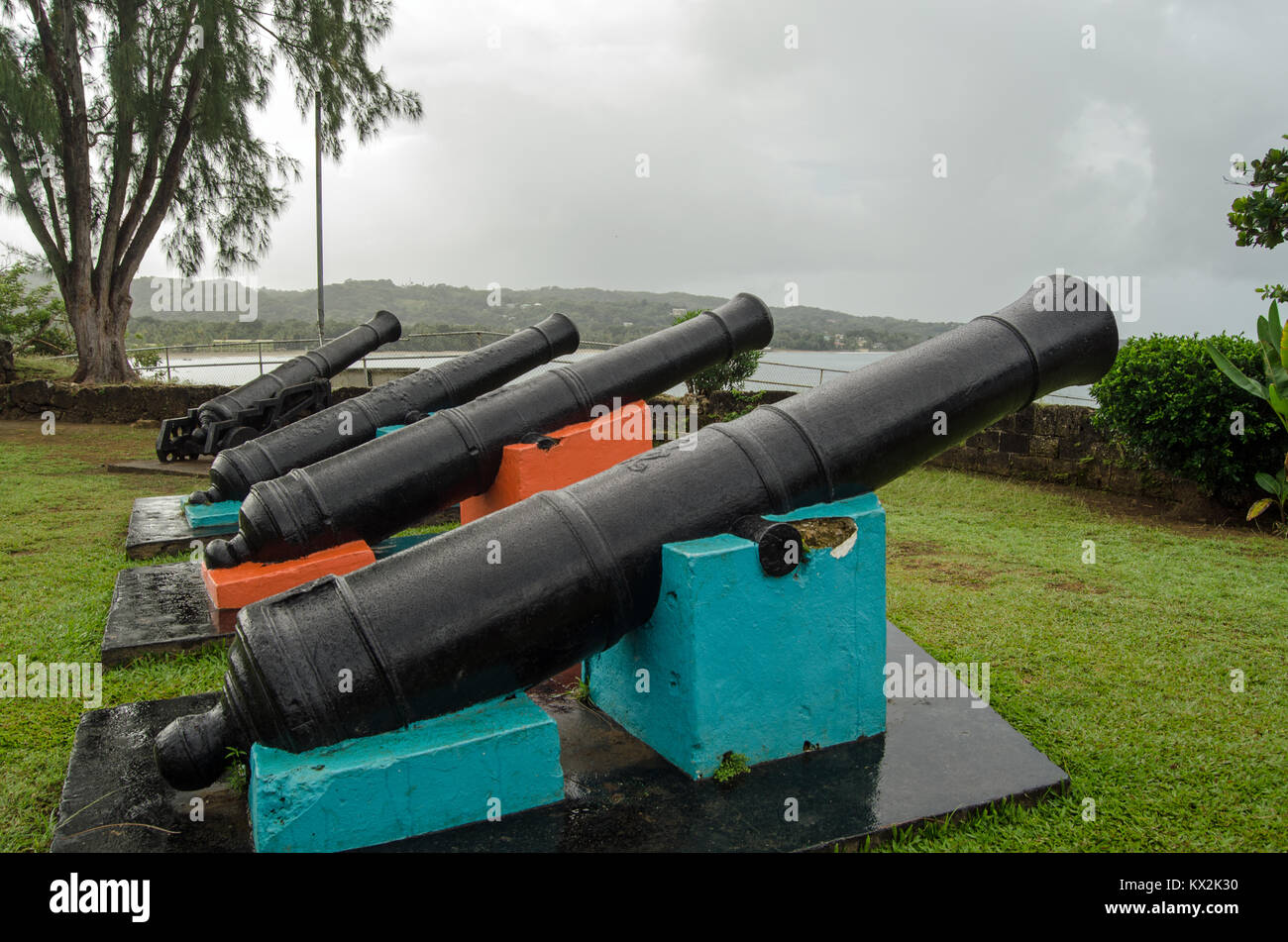 Historic cannon pointing out to sea at the eighteenth century Fort James on the Caribbean coastline of Tobago, Trinidad and Tobago.  The fort was used Stock Photo
