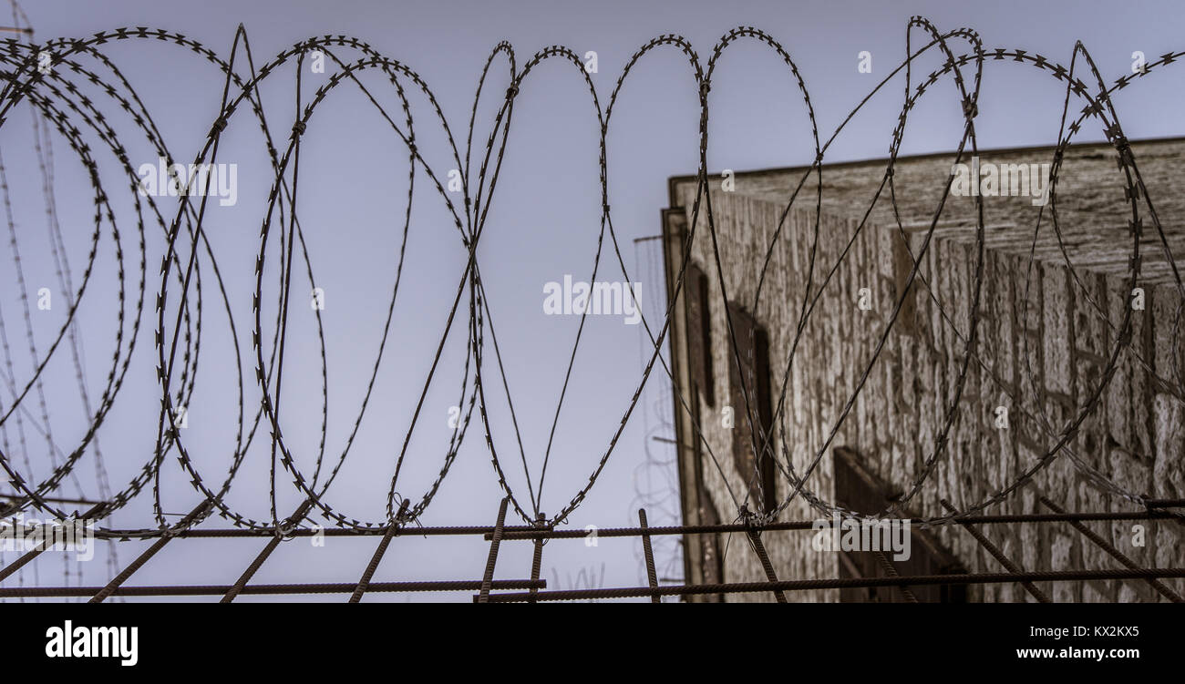 Old fence with barbed wire Stock Photo - Alamy