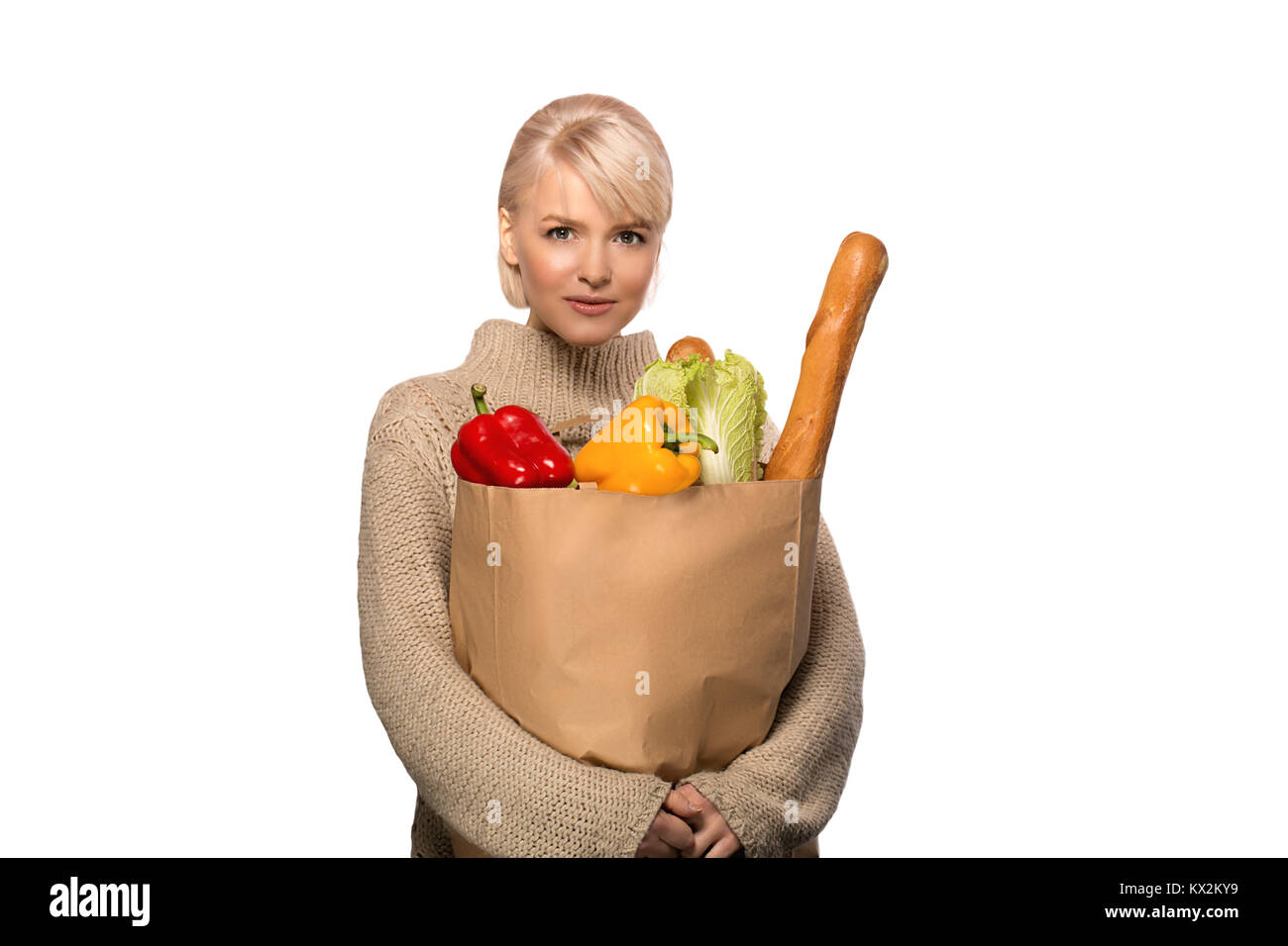 Portrait of happy smiling woman with groceries shopping bag full of vegetables isolated on white background Stock Photo