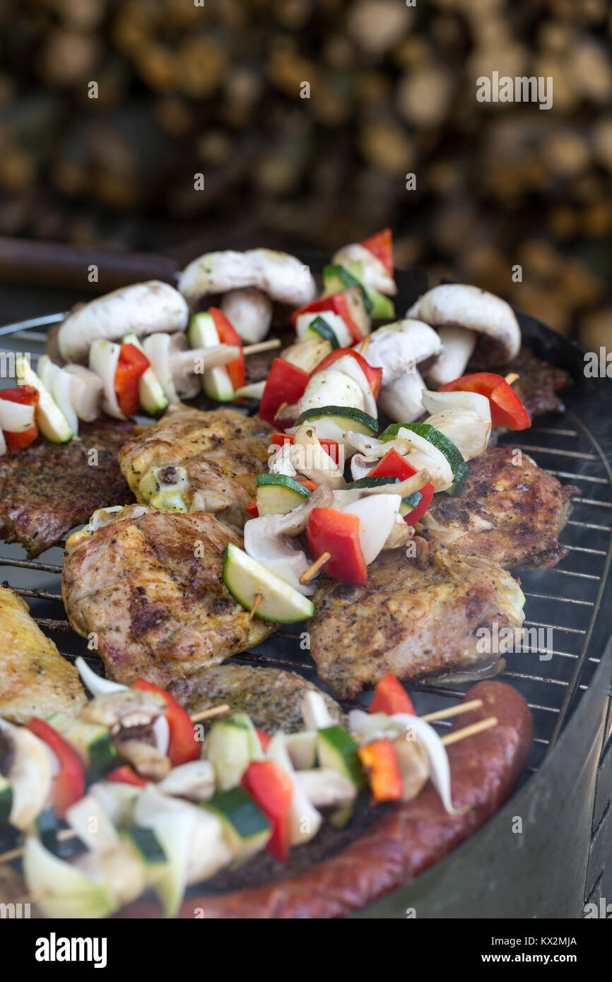 barbecue with delicious grilled meat and vegetables on grill Stock ...