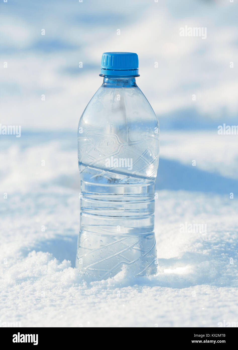 water bottle in snow Stock Photo
