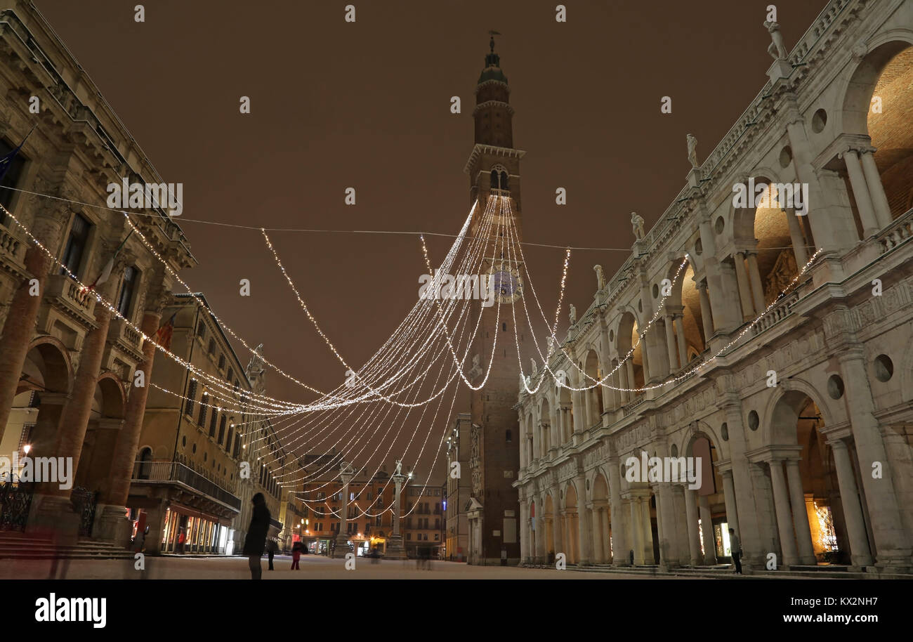 Main square called PIAZZA DEI SIGNORI in Vicenza in Italy with snow by night and the ancient duilding called Basilica Palladiana headquarters of the t Stock Photo