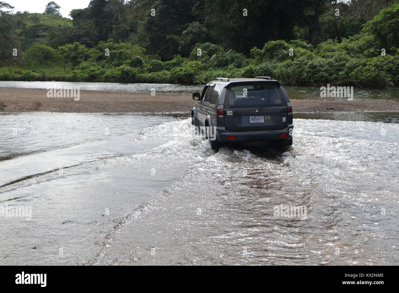 Car crossing river near Drake Bay Costa Rica Osa Peninsula Stock Photo