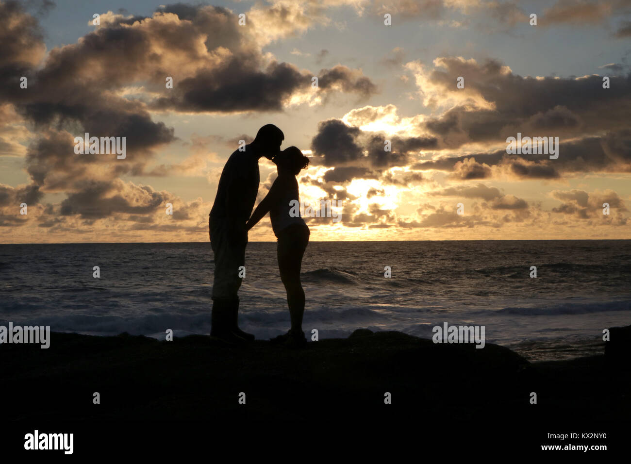 Couple on beach at sunset Costa Rica Pacific coast, the Osa Peninsula Stock Photo