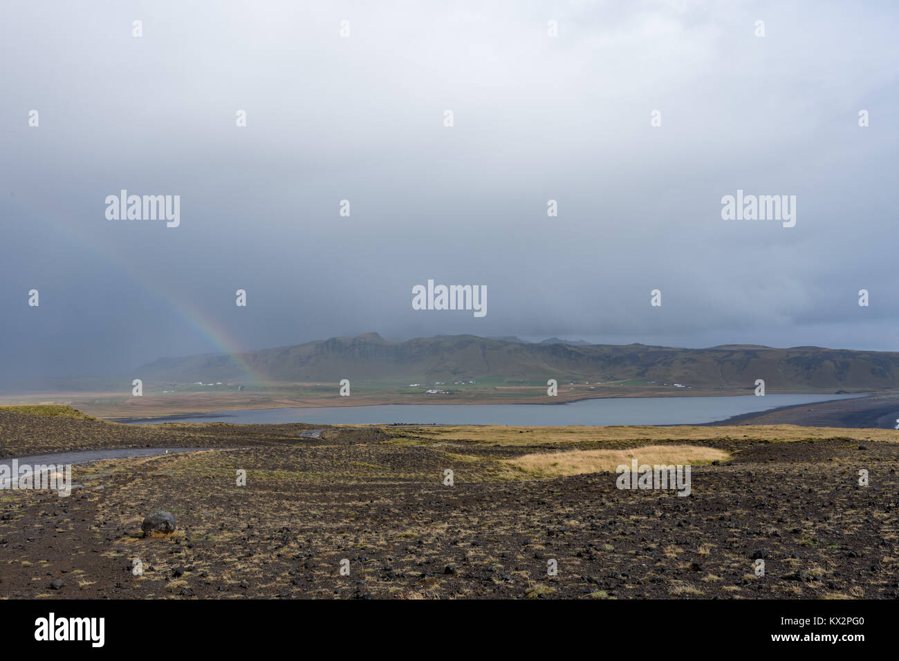 Rainbow over the lake Stock Photo - Alamy