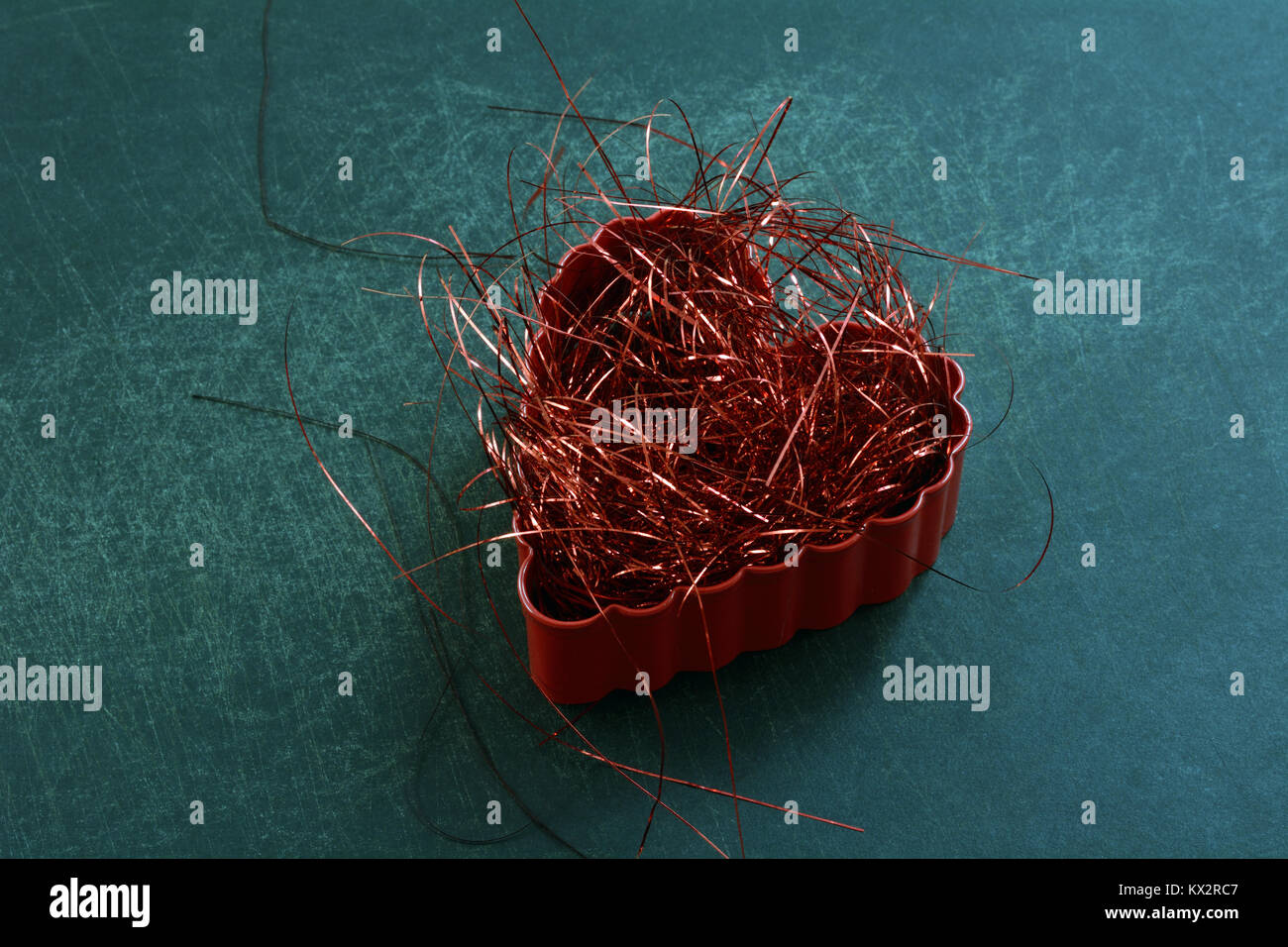 Anti-valentine concept of shredded red heart for divorce, separation or other break up Stock Photo